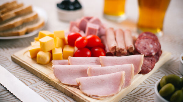 Wood platter with cured meat and cheese