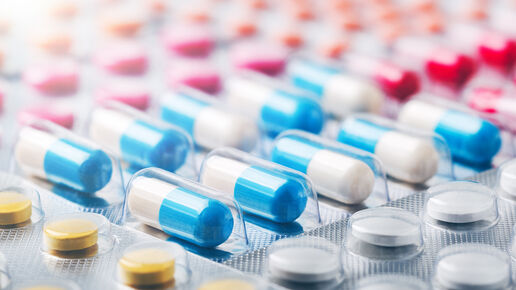 Antimicrobial resistance, white, blue and other colors pills in plastic package